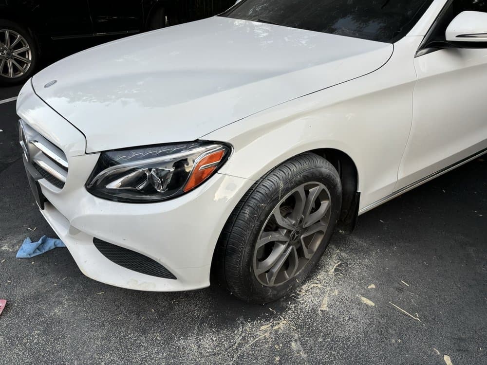 Expert paintless dent repair technician at work