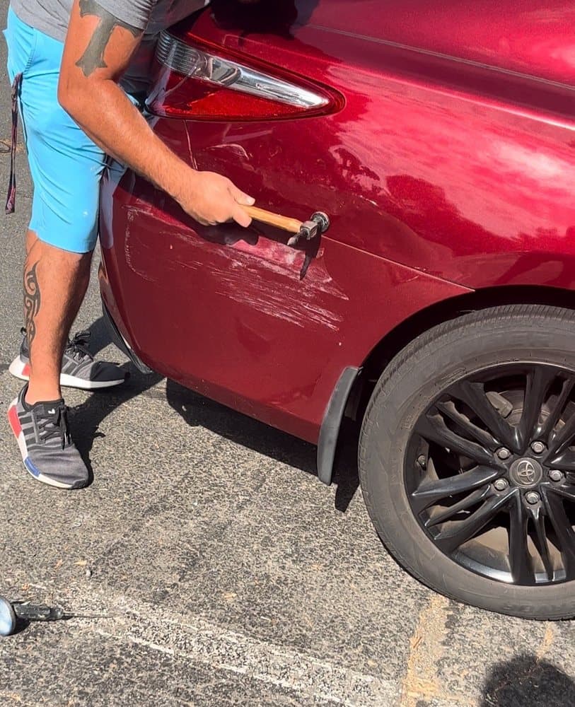 Professional mobile dent repair service in action